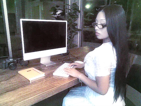 Hana, Seattle photographer and founder of Sunday Office, at her desk